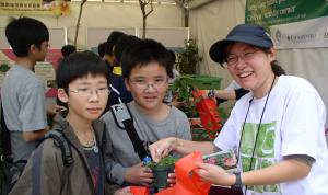 child with a pot plant