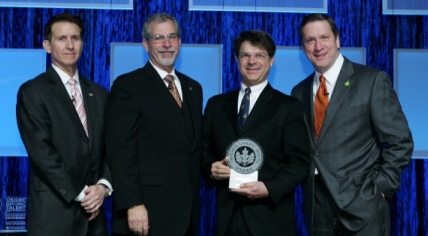 Photo of award to Richard Piacentini